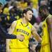 Michigan sophomore Jon Horford and senior Zack Novak greet sophomore Tim Hardaway Jr. as he exits the game after a foul in the second half of the second round of the NCAA tournament at Bridgestone Arena in Nashville, Tenn.  Melanie Maxwell I AnnArbor.com